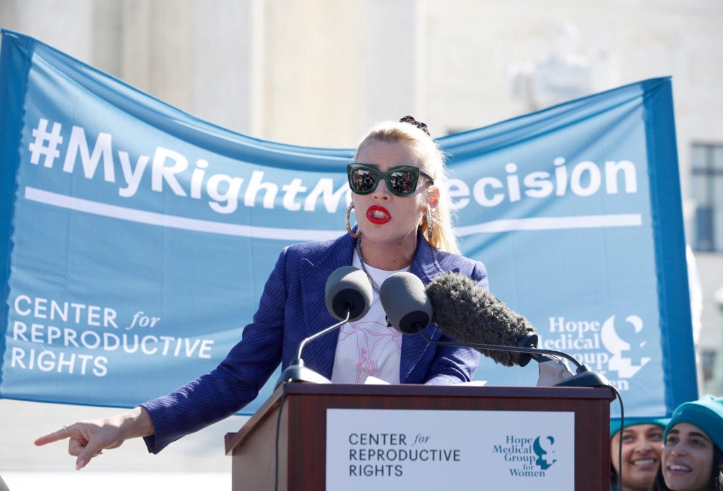 Speaker addressing the crowd at the Supreme Court rally